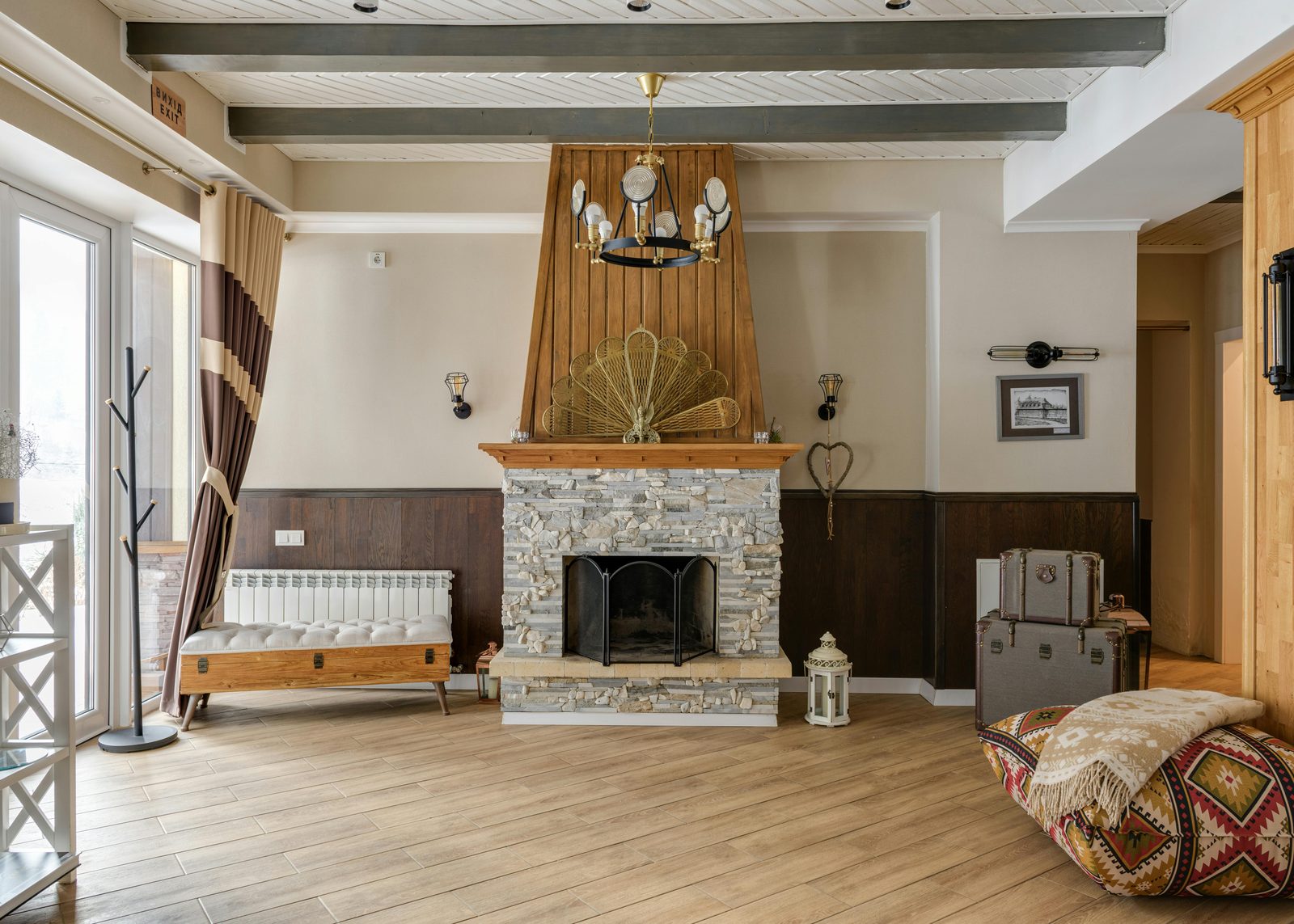 Living room with a stacked stone fireplace
