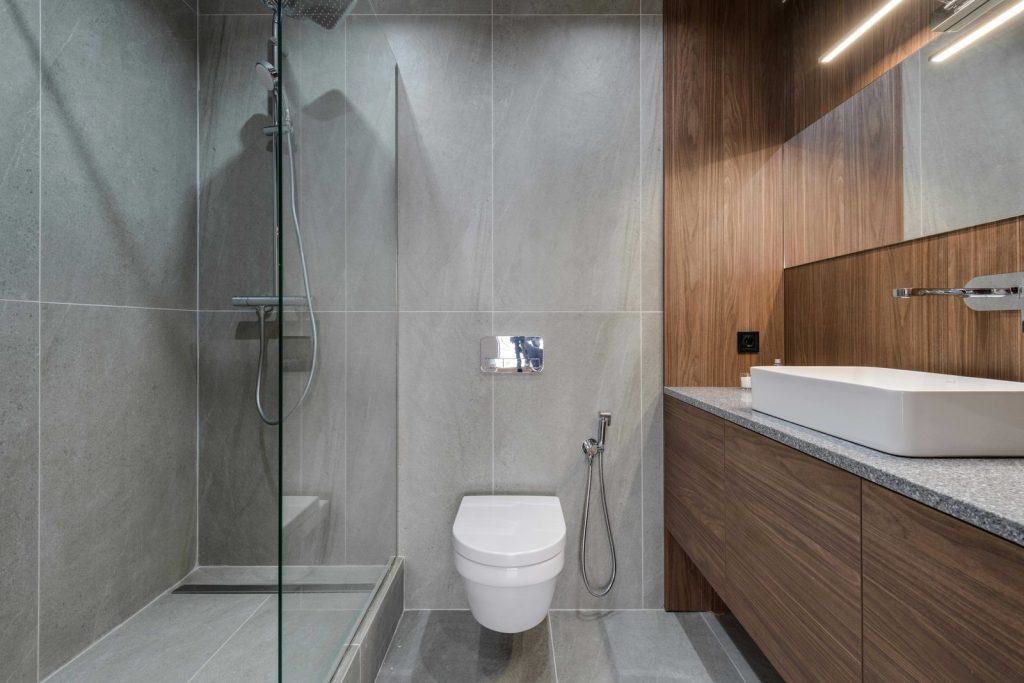 Walk-in shower with large-format grey tile